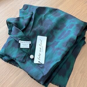 100% silk green and navy animal print scarf. Very large, approx. 80” X 45”.